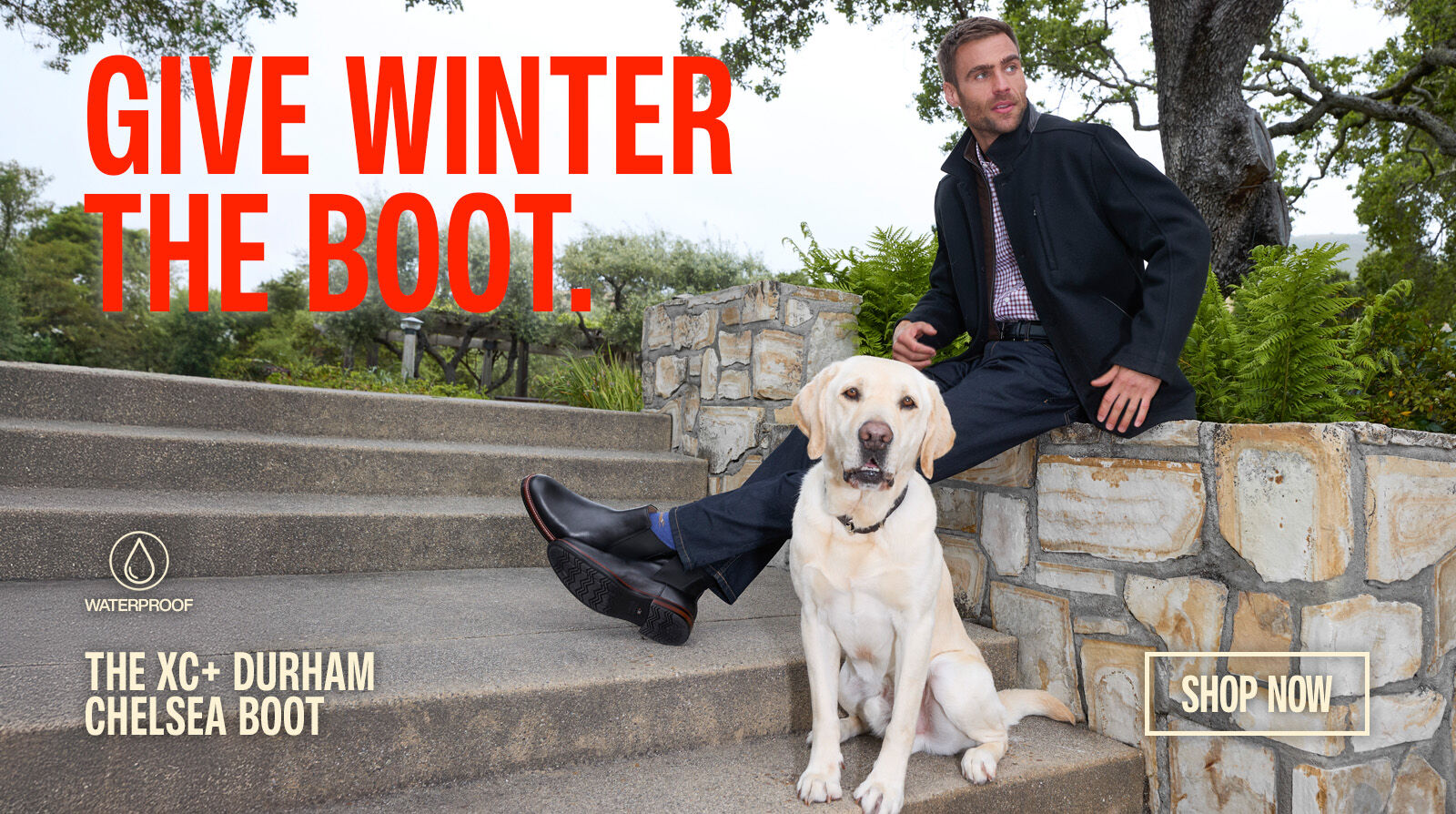 Man and dog sitting on stone steps outside.